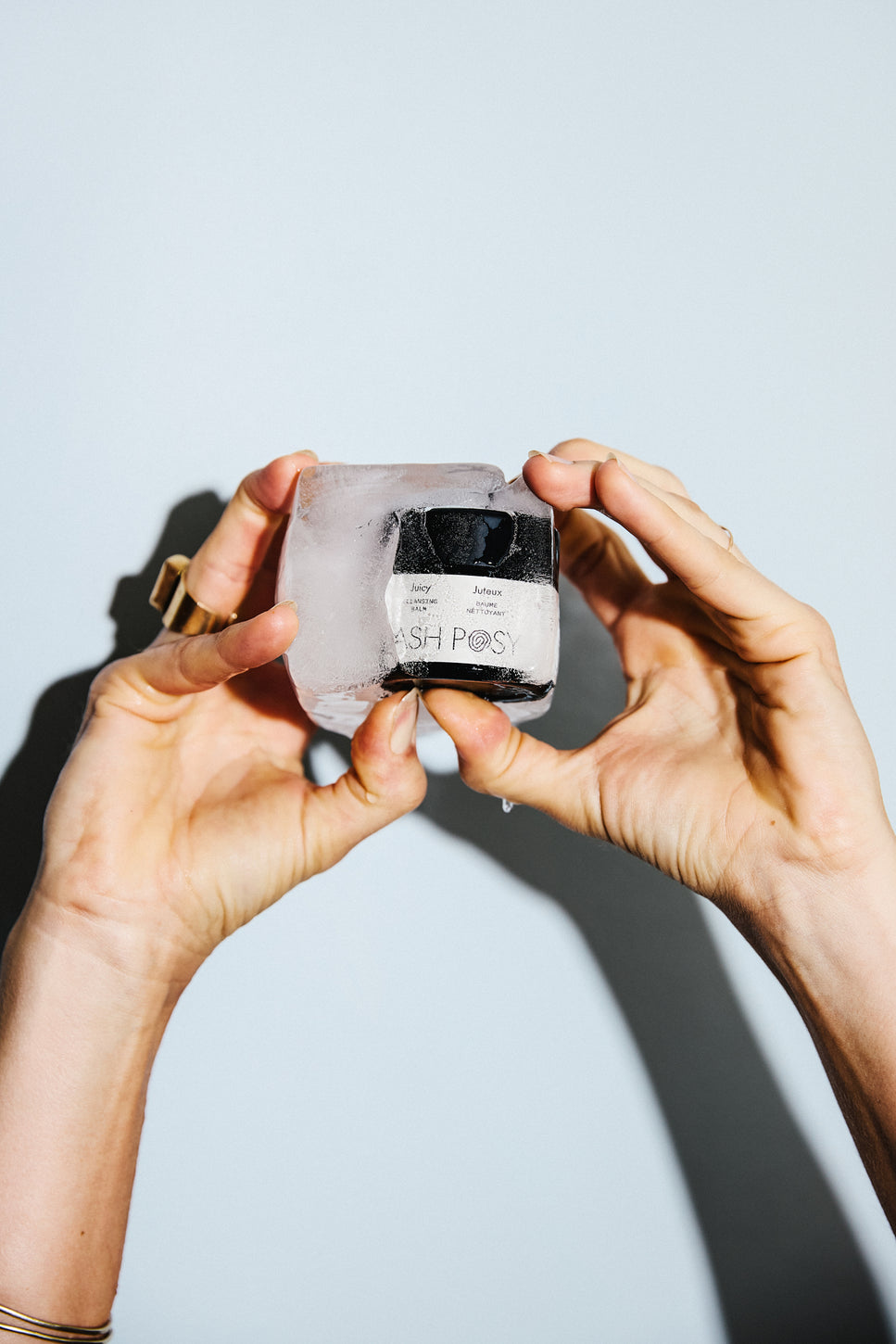 a lady is holding Ashposy clensing balm